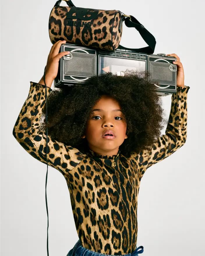 Kid with boombox wearing leopard print
